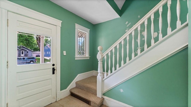 723 3rd St SW, Willmar, MN 56201 - tiled entryway with stairs and baseboards
