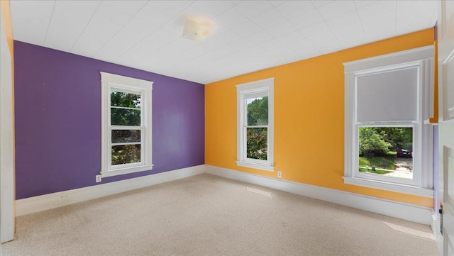 723 3rd St SW, Willmar, MN 56201 - carpeted spare room featuring healthy amount of natural light and baseboards