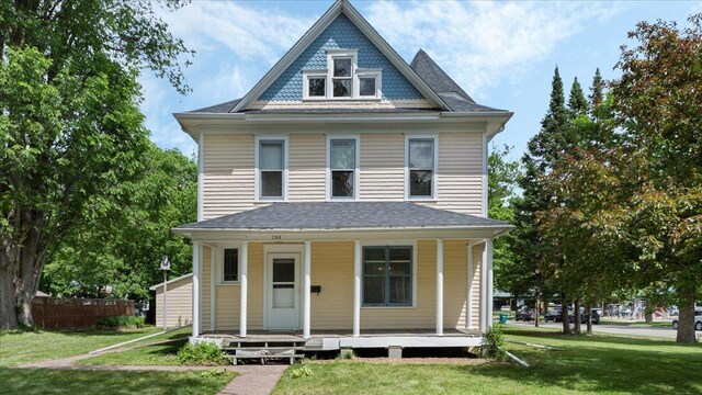 723 3rd St SW, Willmar, MN 56201 - victorian home featuring a porch