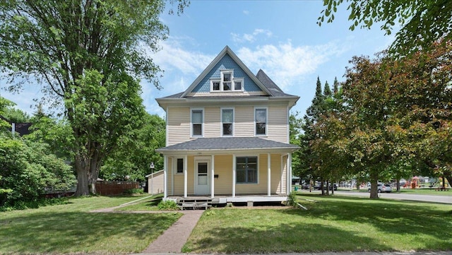 723 3rd St SW, Willmar, MN 56201 - view of front of home featuring a porch and a front yard
