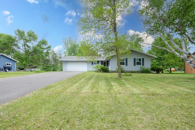 6330 Kenwood Rd, Saint Cloud, MN 56303 - ranch-style house featuring asphalt driveway, an attached garage, and a front lawn