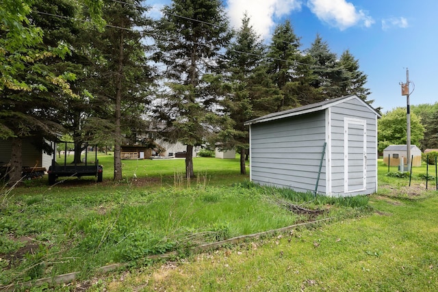6330 Kenwood Rd, Saint Cloud, MN 56303 - view of green lawn with a storage unit and an outbuilding