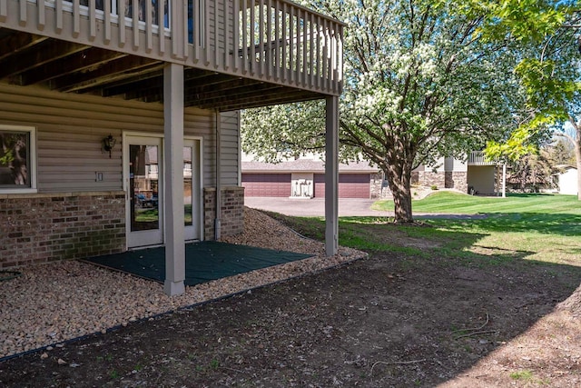 view of green lawn with a deck