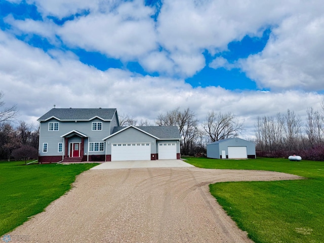 3358 70th Ave N, Moorhead, MN 56560 - view of front of house with driveway, a front yard, and an attached garage