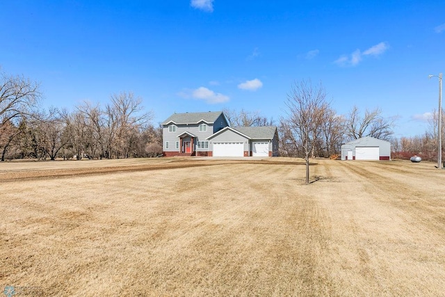 3358 70th Ave N, Moorhead, MN 56560 - traditional-style house with driveway, a garage, and a front yard
