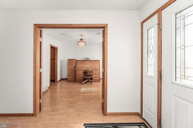 3358 70th Ave N, Moorhead, MN 56560 - foyer with light wood-style floors, healthy amount of natural light, and baseboards