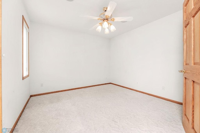 3358 70th Ave N, Moorhead, MN 56560 - empty room featuring light colored carpet, baseboards, and a ceiling fan