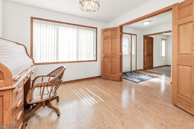 3358 70th Ave N, Moorhead, MN 56560 - office with light wood-style floors, baseboards, and a chandelier