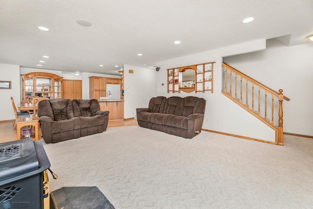 3358 70th Ave N, Moorhead, MN 56560 - living area with recessed lighting, light colored carpet, baseboards, stairway, and a textured ceiling