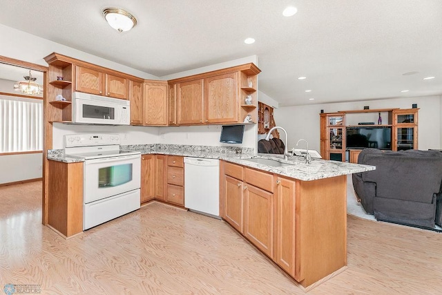 3358 70th Ave N, Moorhead, MN 56560 - kitchen with white appliances, open shelves, a sink, open floor plan, and a peninsula