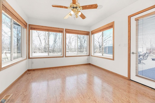 3358 70th Ave N, Moorhead, MN 56560 - unfurnished sunroom with wood finished floors and healthy amount of natural light