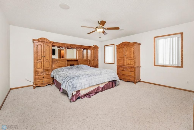 3358 70th Ave N, Moorhead, MN 56560 - bedroom with baseboards, light colored carpet, and ceiling fan