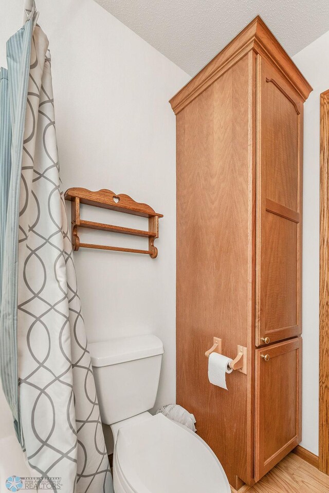 3358 70th Ave N, Moorhead, MN 56560 - bathroom with toilet and a shower with curtain