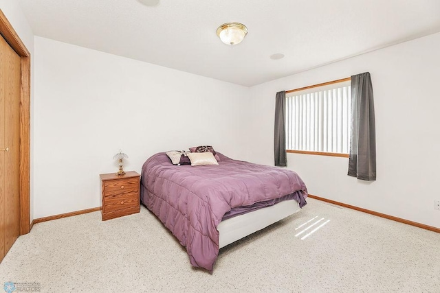 3358 70th Ave N, Moorhead, MN 56560 - bedroom with baseboards and light carpet
