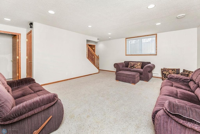 3358 70th Ave N, Moorhead, MN 56560 - living room with stairs, carpet flooring, a baseboard heating unit, a textured ceiling, and baseboards
