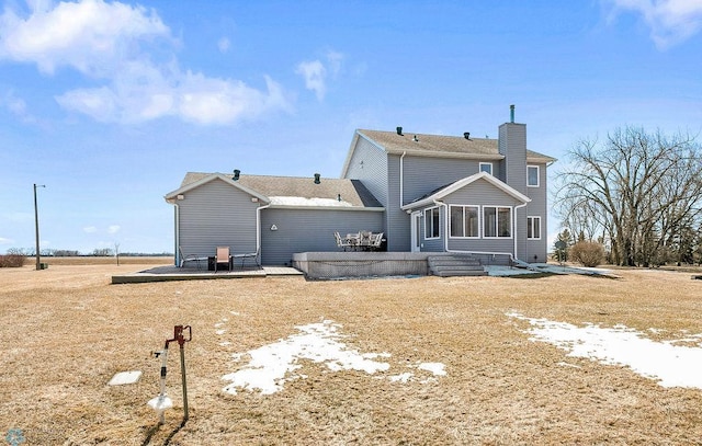 3358 70th Ave N, Moorhead, MN 56560 - back of property with a patio and a chimney