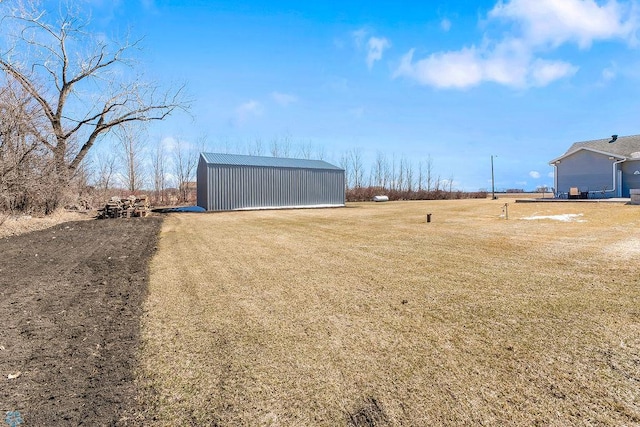 3358 70th Ave N, Moorhead, MN 56560 - view of grassy yard with an outbuilding