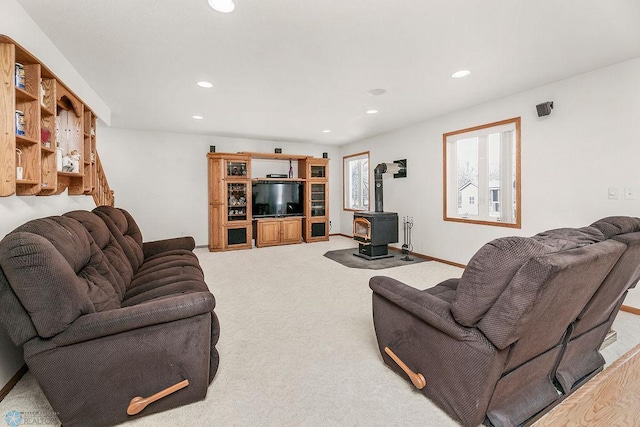 3358 70th Ave N, Moorhead, MN 56560 - living area with a wood stove, recessed lighting, and light carpet