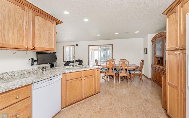 3358 70th Ave N, Moorhead, MN 56560 - kitchen featuring white dishwasher, light wood-style floors, a peninsula, light stone countertops, and recessed lighting