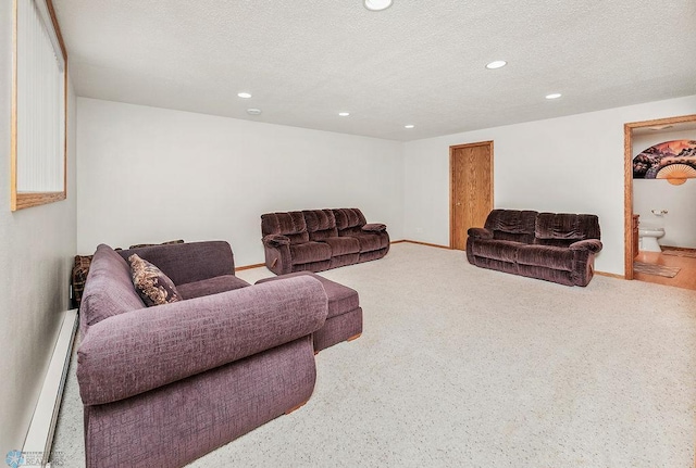 3358 70th Ave N, Moorhead, MN 56560 - living room featuring a baseboard radiator, recessed lighting, a textured ceiling, and carpet flooring