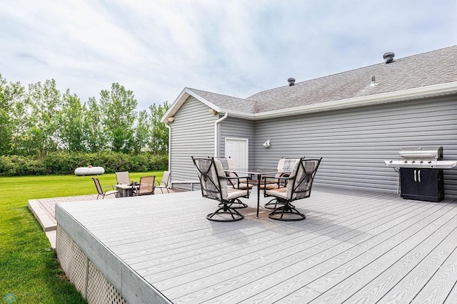 3358 70th Ave N, Moorhead, MN 56560 - deck featuring outdoor dining space, a grill, and a yard