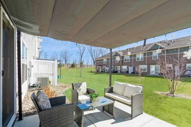 view of patio / terrace with cooling unit, an outdoor hangout area, and a residential view