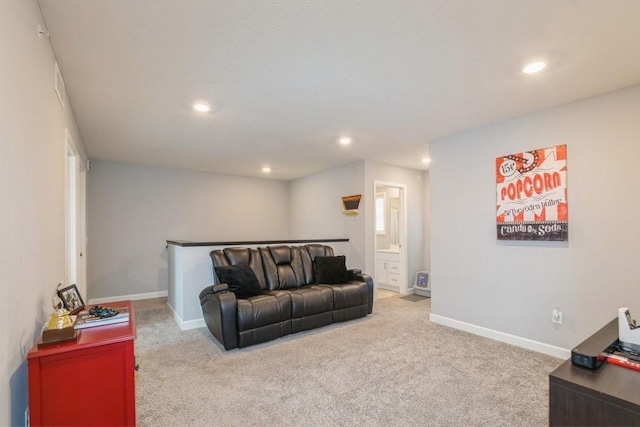 living area featuring baseboards, carpet flooring, and recessed lighting