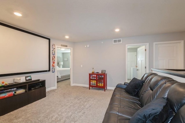 cinema featuring recessed lighting, baseboards, visible vents, and light colored carpet
