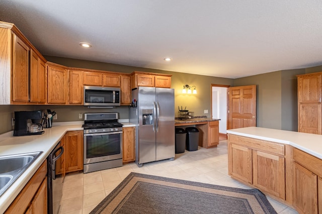 34506 Pleasant Point Dr, Homer Twp, MN 55987 - kitchen featuring appliances with stainless steel finishes, recessed lighting, light countertops, a sink, and light tile patterned flooring
