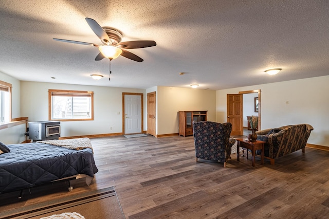 34506 Pleasant Point Dr, Homer Twp, MN 55987 - bedroom featuring a textured ceiling, baseboards, wood finished floors, and a ceiling fan