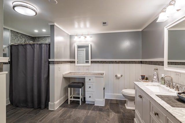 34506 Pleasant Point Dr, Homer Twp, MN 55987 - bathroom with ornamental molding, a shower with shower curtain, toilet, vanity, and a wainscoted wall