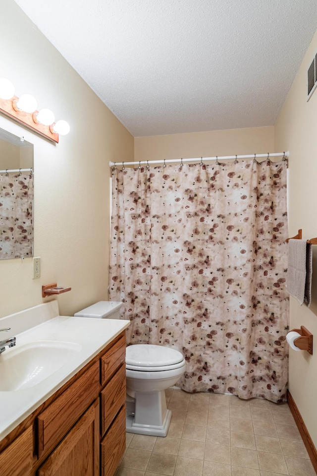 34506 Pleasant Point Dr, Homer Twp, MN 55987 - full bath featuring vanity, toilet, tile patterned floors, and a textured ceiling