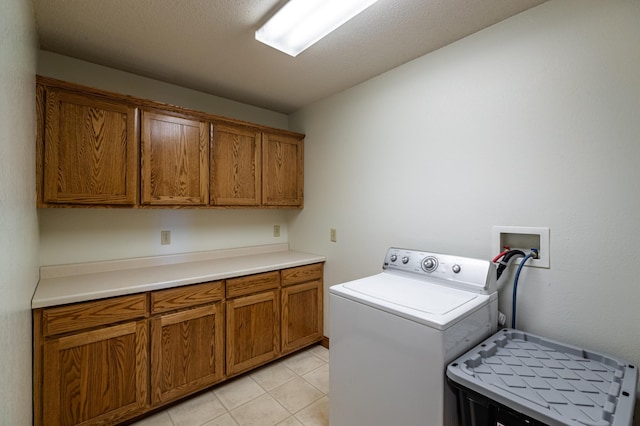 34506 Pleasant Point Dr, Homer Twp, MN 55987 - washroom with washer / clothes dryer, cabinet space, and light tile patterned floors