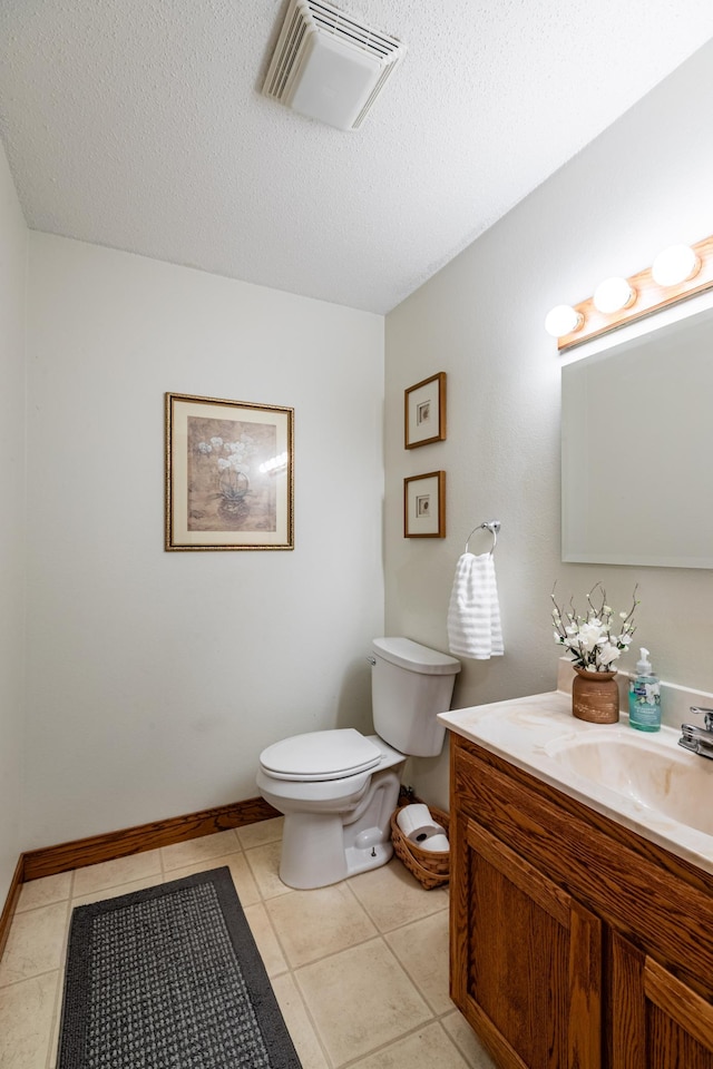 34506 Pleasant Point Dr, Homer Twp, MN 55987 - half bath with toilet, vanity, a textured ceiling, and tile patterned flooring