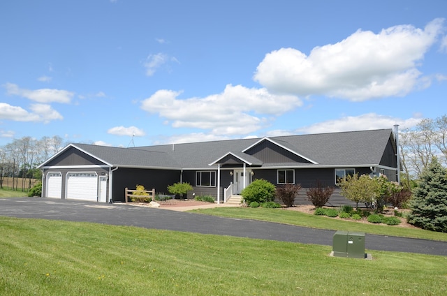34506 Pleasant Point Dr, Homer Twp, MN 55987 - ranch-style house featuring an attached garage, driveway, a front yard, and a shingled roof
