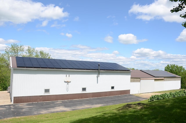 34506 Pleasant Point Dr, Homer Twp, MN 55987 - view of property exterior featuring solar panels
