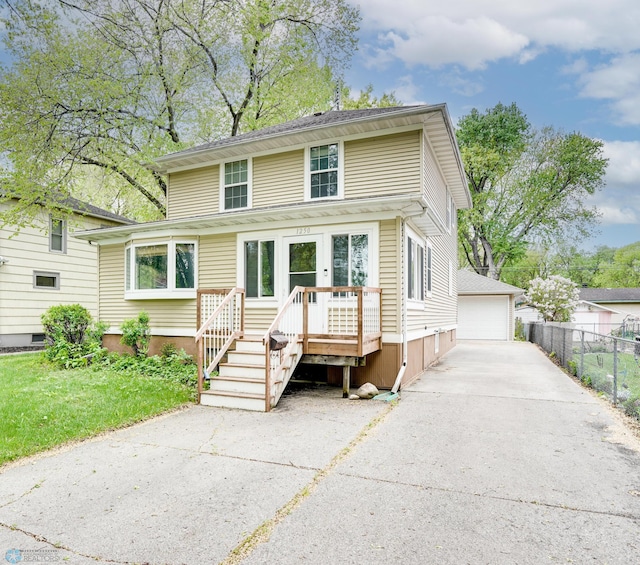 1250 8th St N, Fargo, ND 58102 - american foursquare style home featuring a detached garage and an outbuilding