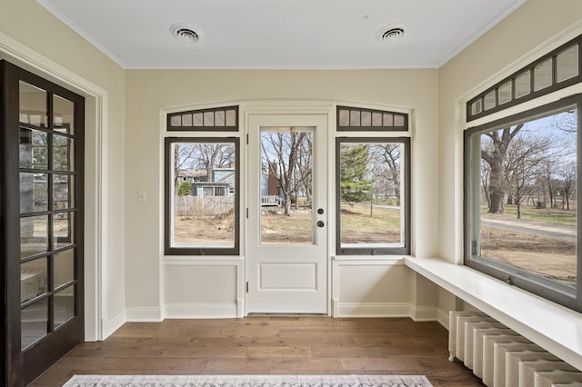 4767 Lake Ave, White Bear Lake, MN 55110 - entryway with dark wood-style floors, ornamental molding, and baseboards