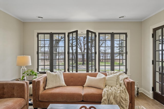 4767 Lake Ave, White Bear Lake, MN 55110 - living area featuring light wood-style floors, crown molding, and baseboards