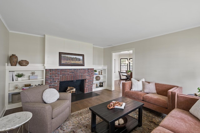 4767 Lake Ave, White Bear Lake, MN 55110 - living area with wood finished floors, crown molding, baseboards, and a brick fireplace