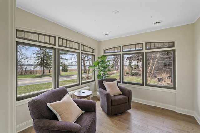 4767 Lake Ave, White Bear Lake, MN 55110 - sitting room featuring baseboards, crown molding, and wood-type flooring