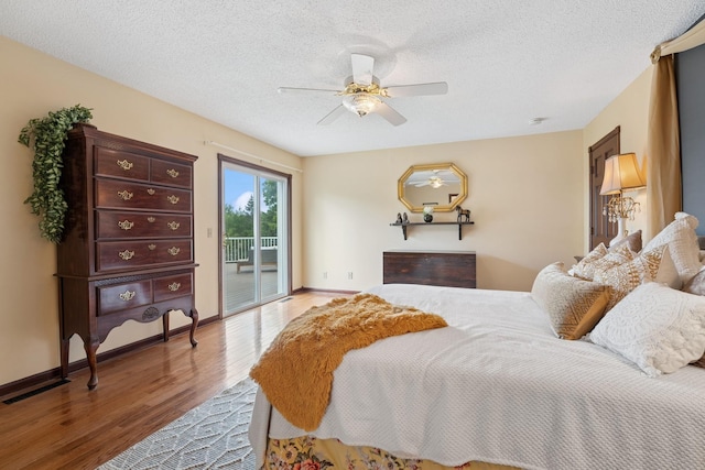 19826 Dakota Ave, Prior Lake, MN 55372 - bedroom featuring wood finished floors, access to outside, ceiling fan, baseboards, and a textured ceiling