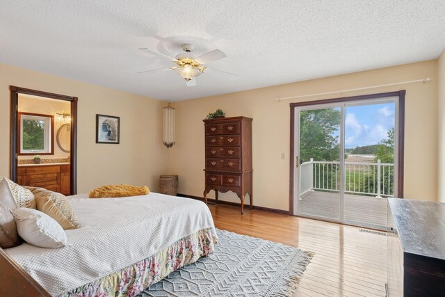 19826 Dakota Ave, Prior Lake, MN 55372 - bedroom with access to outside, wood finished floors, a textured ceiling, ensuite bathroom, and ceiling fan