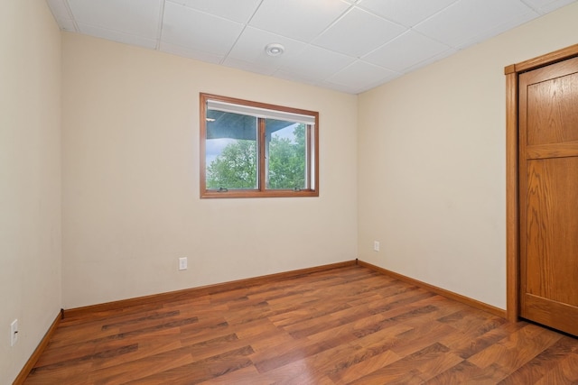 19826 Dakota Ave, Prior Lake, MN 55372 - spare room with wood finished floors, baseboards, and a paneled ceiling