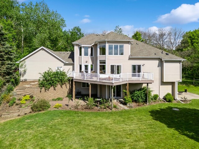 19826 Dakota Ave, Prior Lake, MN 55372 - back of property with a wooden deck, a yard, and roof with shingles