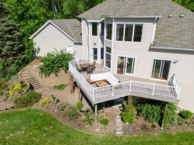 19826 Dakota Ave, Prior Lake, MN 55372 - rear view of property featuring roof with shingles, a deck, outdoor dining space, and a yard