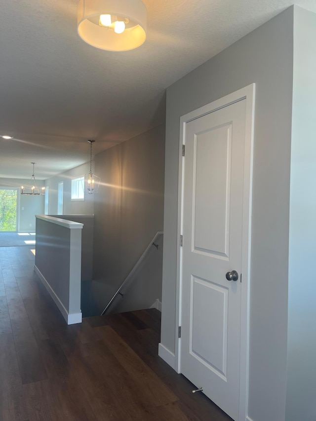 1591 76th St W, Inver Grove Heights, MN 55077 - hall with an upstairs landing, baseboards, and dark wood-style flooring