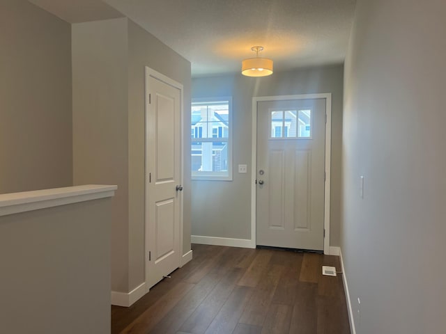 1591 76th St W, Inver Grove Heights, MN 55077 - doorway with dark wood-style floors and baseboards