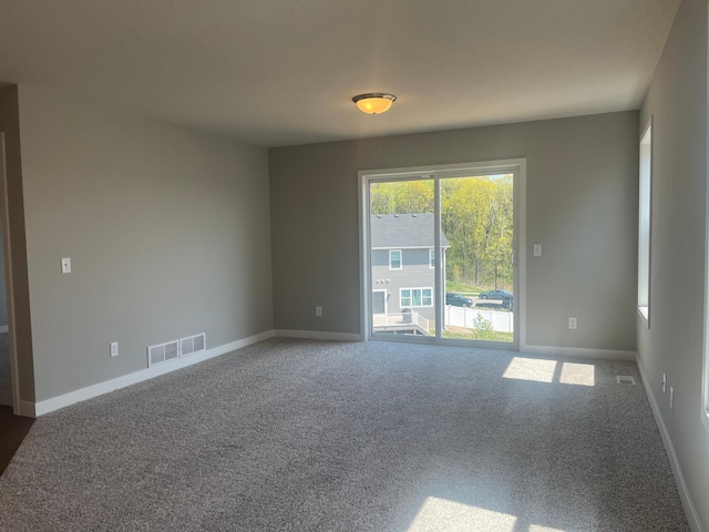 1591 76th St W, Inver Grove Heights, MN 55077 - spare room with carpet floors and baseboards