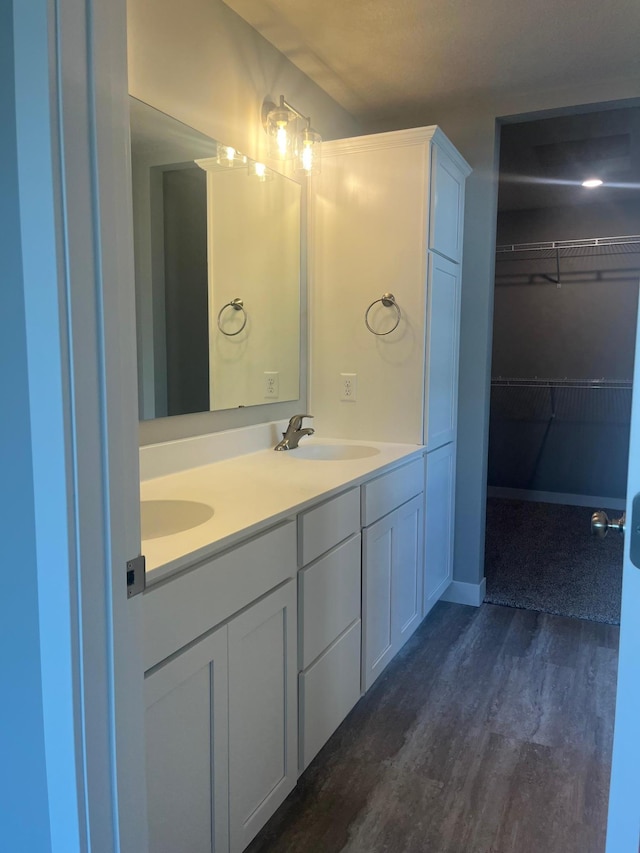 1591 76th St W, Inver Grove Heights, MN 55077 - full bath with wood finished floors, double vanity, and a spacious closet